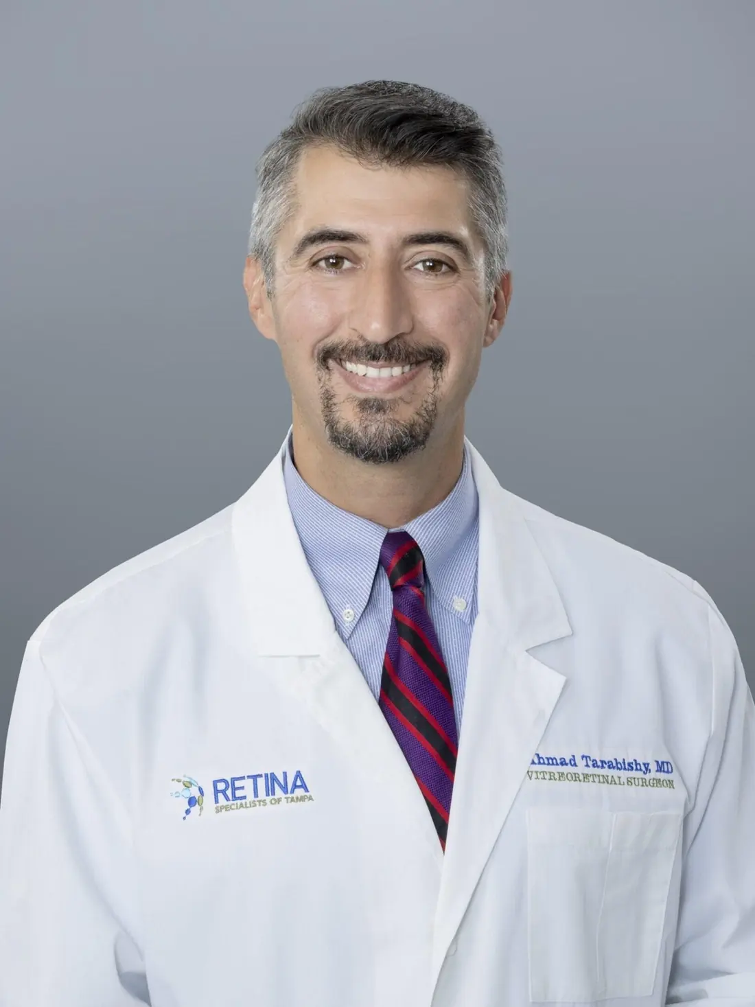 Dr. Ahmad B. Tarabishy in his lab coat, embroidered Ahmad Tarabishy MD, Vitreoretinal Surgeon